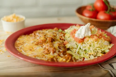 #7 Burrito verde, bean tostada & cheese enchilada