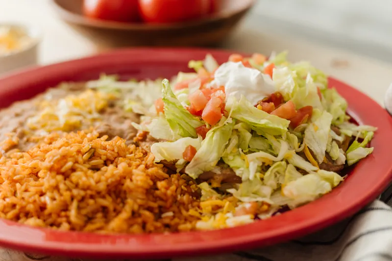 Bean tostada combo plate with rice and beans at Su Casa Midvale