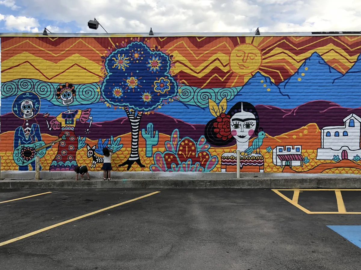 Colorful Mexican folk art mural on the outside wall of Su Casa Mexican Restaurant in Midvale, Utah